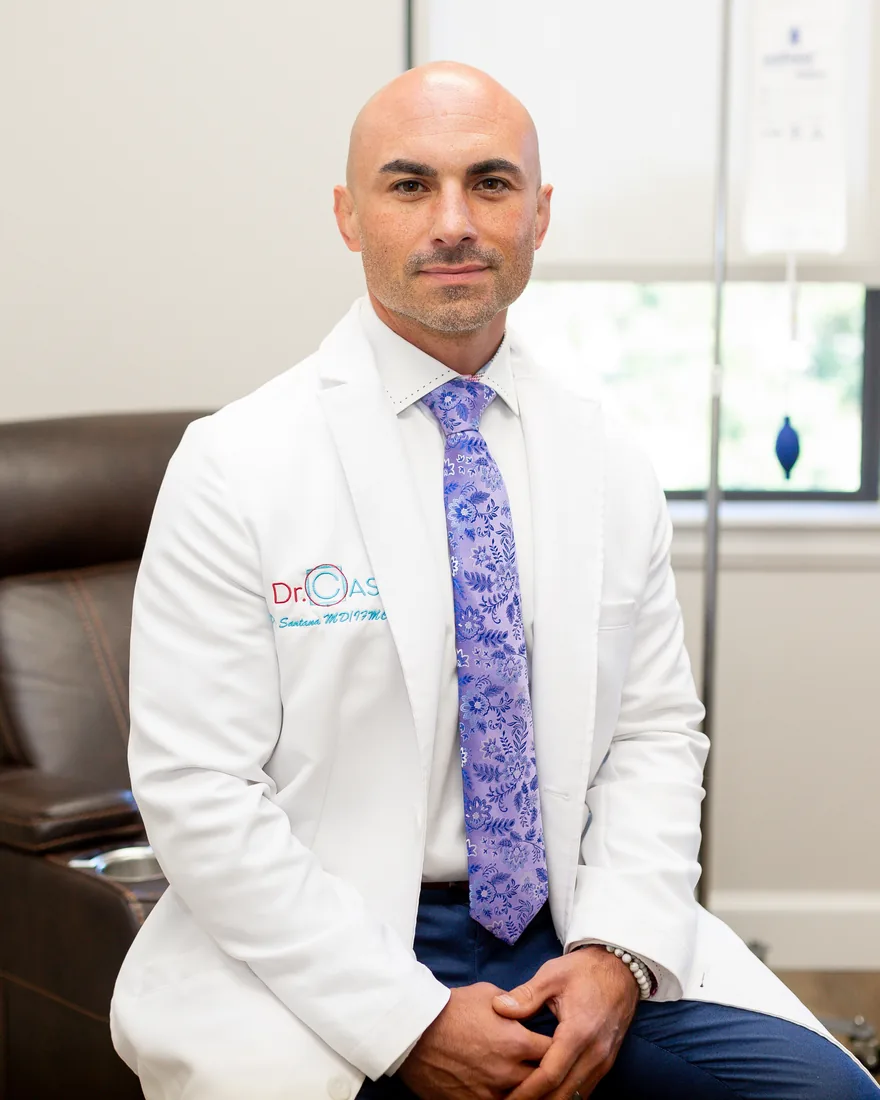 Dr. Cas in a white coat in the IV therapy room